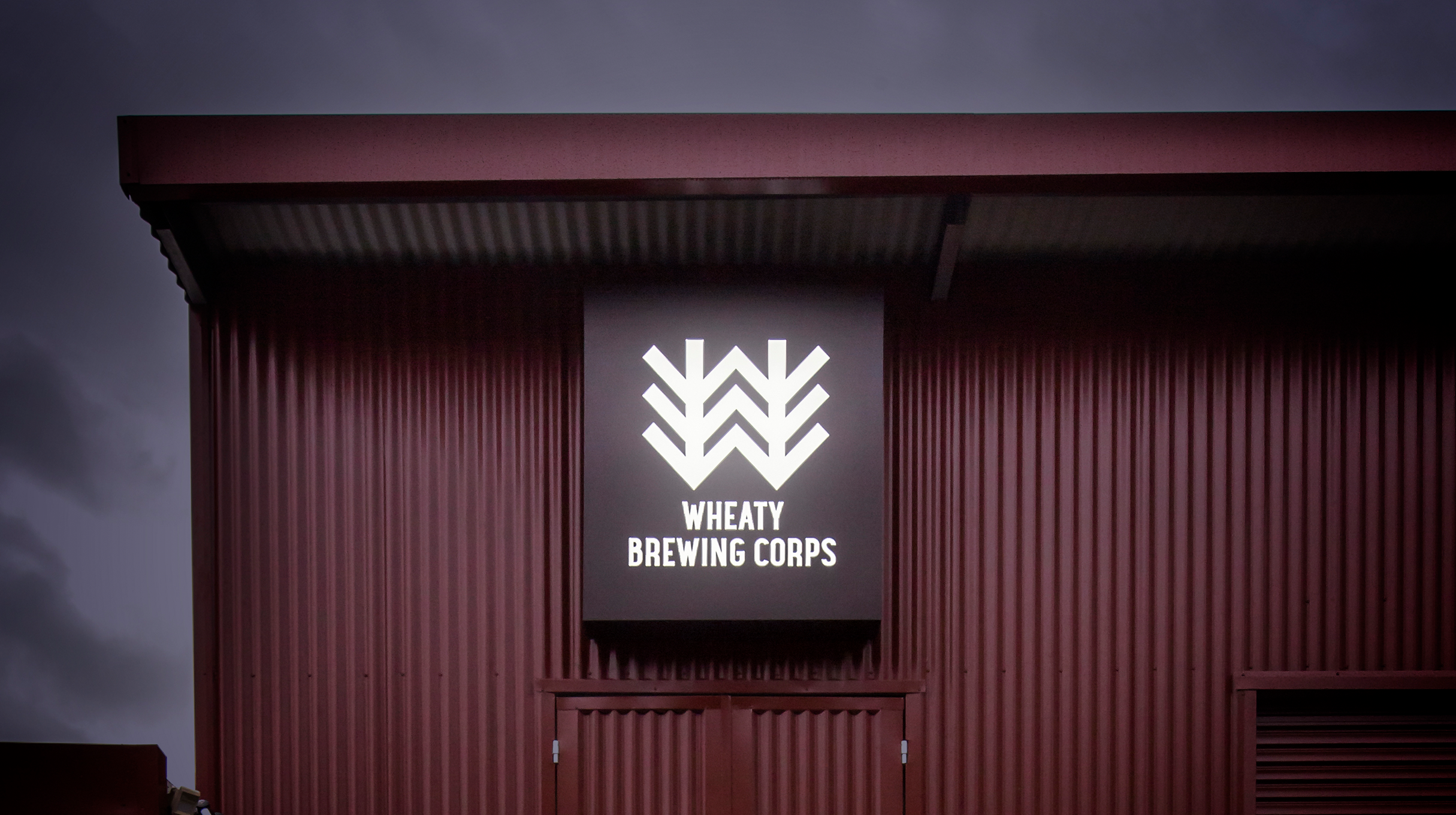 Wheaty Brewing Corps - Illuminated sign on a shed