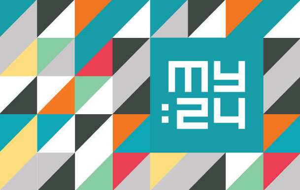 My:24 on a coloured geometric background