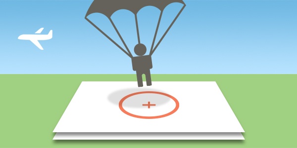 Illustration of a person parachuting, about to land on a marker.
