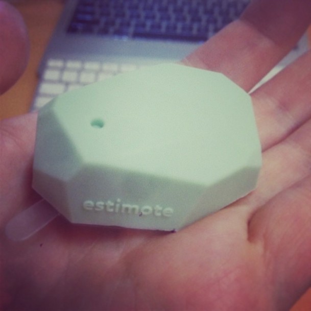 Holding a 'estimote' beacon - a palm sized geometric plastic shape