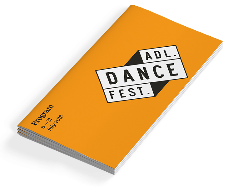 Adelaide Dance Festival program cover - a bright orange rectangular booklet with the logo in black and white